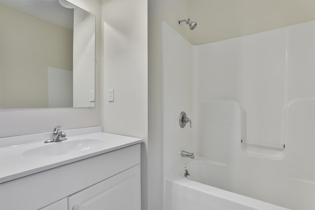 bathroom with vanity and shower / washtub combination