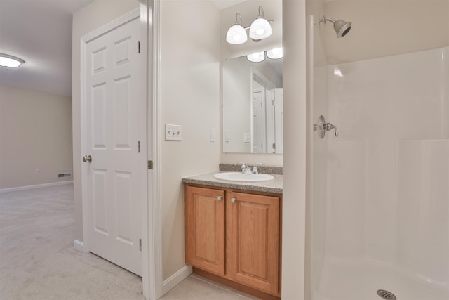 bathroom with vanity and walk in shower