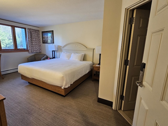 carpeted bedroom with a baseboard radiator