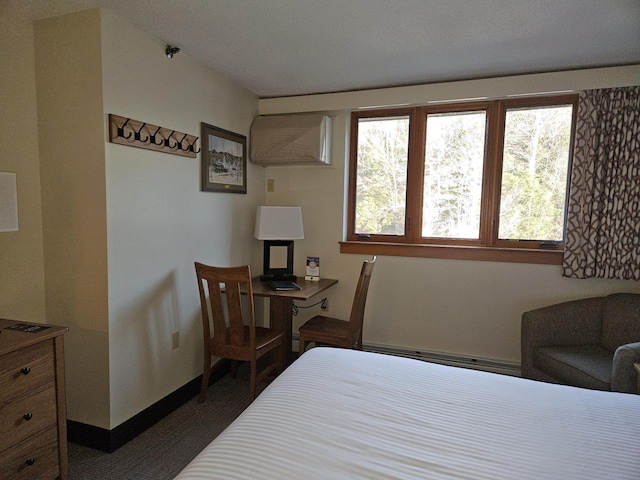 bedroom with dark carpet and a baseboard radiator