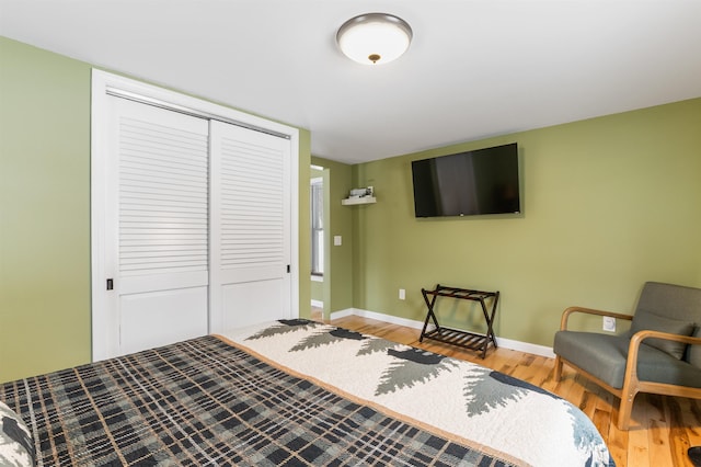 bedroom featuring a closet and light hardwood / wood-style flooring