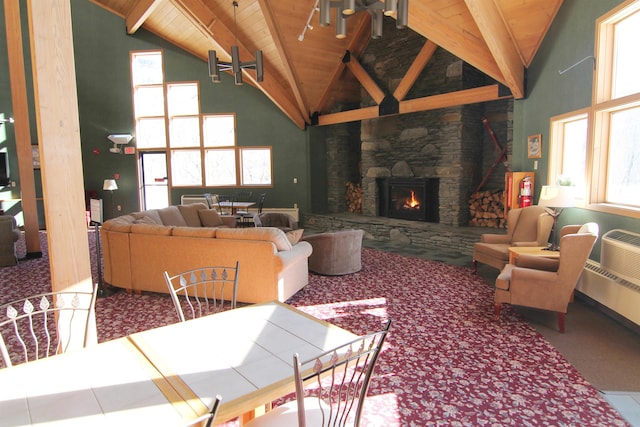 living room with beam ceiling, high vaulted ceiling, wooden ceiling, and a fireplace