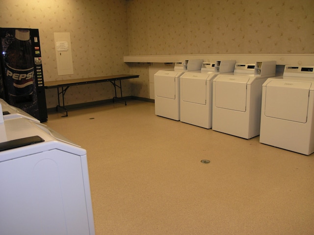 laundry area with independent washer and dryer