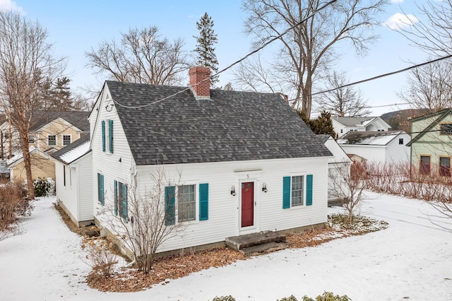 view of new england style home