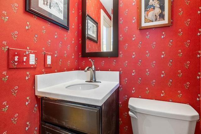 bathroom with vanity and toilet