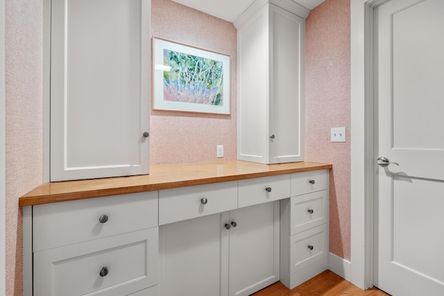 bathroom with vanity and wood-type flooring