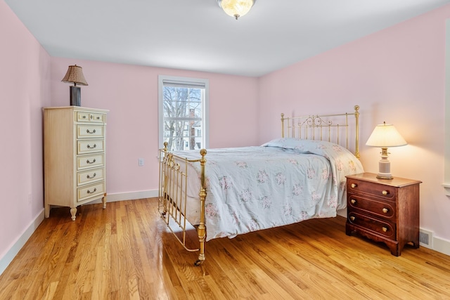 bedroom with light hardwood / wood-style floors