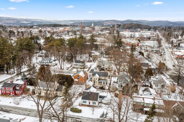 snowy aerial view featuring a mountain view