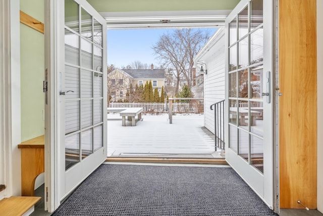 doorway to outside with carpet