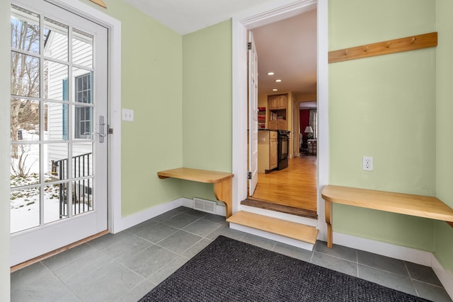 mudroom with tile patterned floors