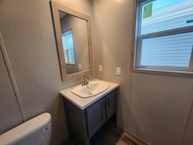 bathroom with vanity and toilet