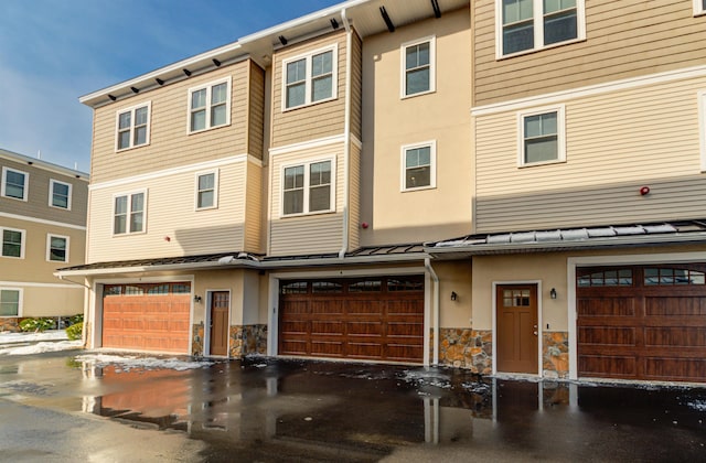 view of front of home with a garage