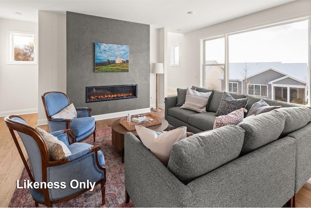 living room with a healthy amount of sunlight and hardwood / wood-style floors