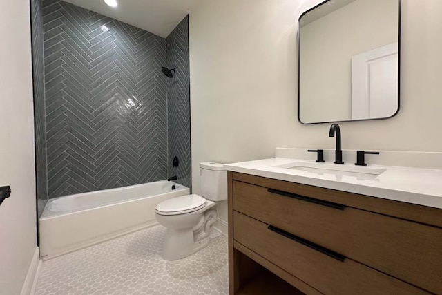 bathroom with baseboards, toilet, bathing tub / shower combination, tile patterned floors, and vanity