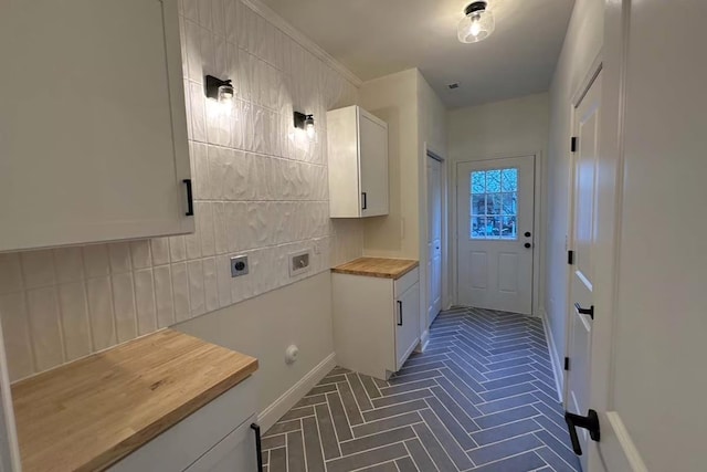 washroom featuring cabinet space, electric dryer hookup, and hookup for a washing machine