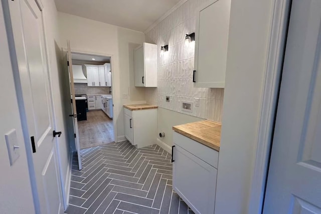 bathroom featuring tile patterned floors and backsplash