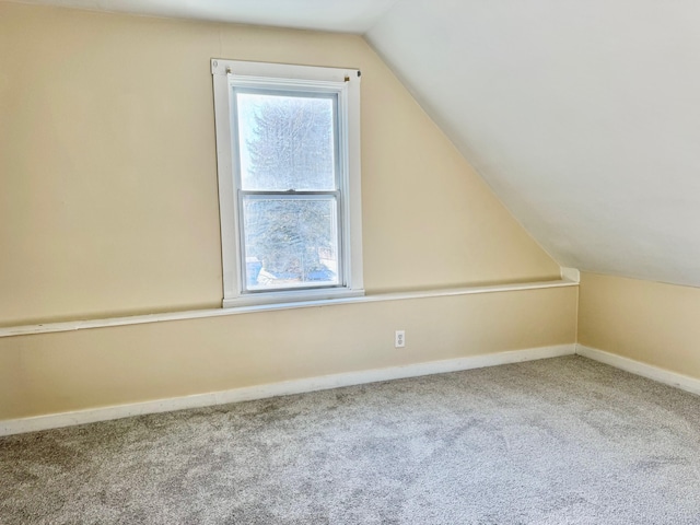 additional living space with carpet floors, plenty of natural light, and lofted ceiling