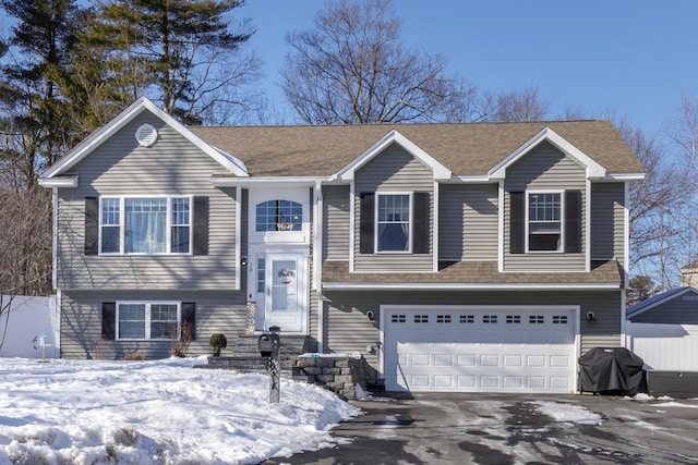 bi-level home featuring a garage