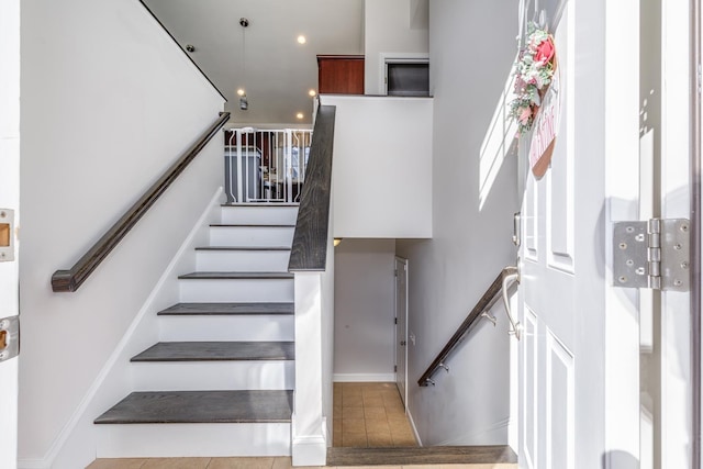 staircase with tile patterned flooring