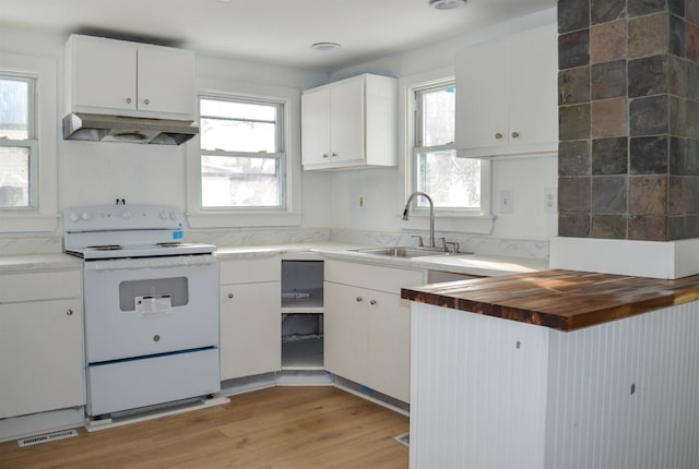 kitchen with white range with electric cooktop, white cabinetry, a sink, wood counters, and under cabinet range hood