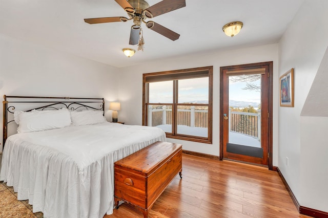 bedroom featuring light hardwood / wood-style floors and access to outside