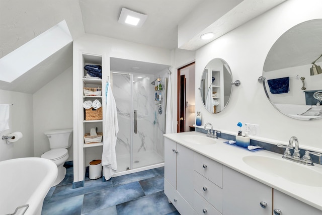 bathroom with toilet, vanity, walk in shower, and vaulted ceiling with skylight