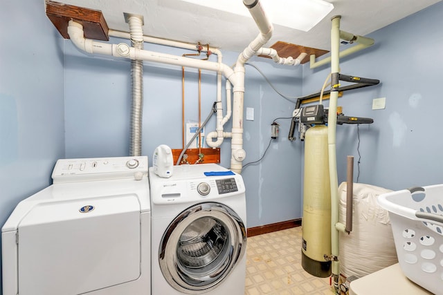 washroom with washing machine and clothes dryer