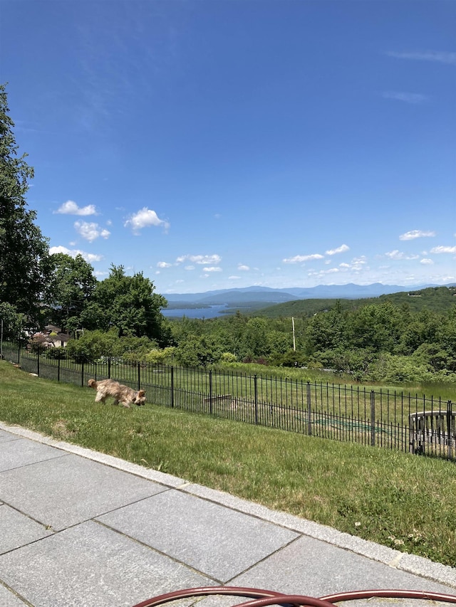 view of patio / terrace with a rural view and a mountain view