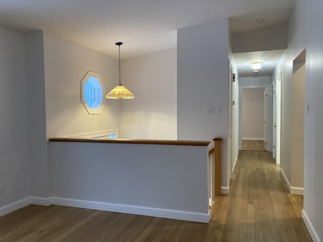 hall with hardwood / wood-style flooring