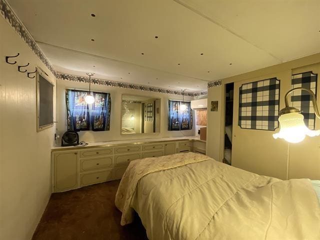 carpeted bedroom with a wall mounted AC