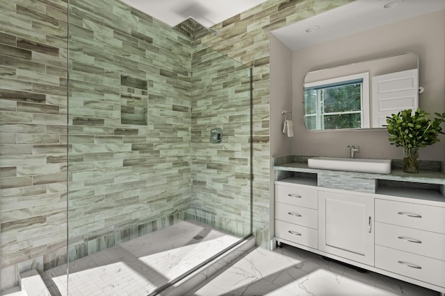 bathroom with vanity and a shower with shower door