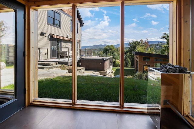 doorway to outside with a mountain view