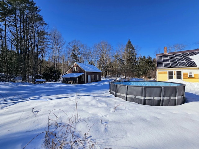 view of snow covered pool