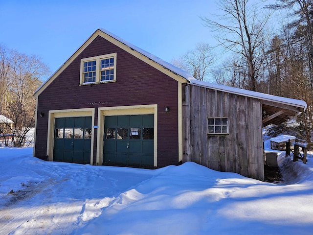 view of snow covered garage