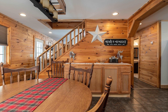 dining area with wooden walls