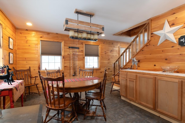 dining area with wooden walls