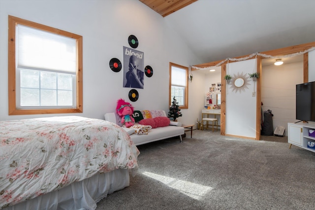 carpeted bedroom featuring high vaulted ceiling