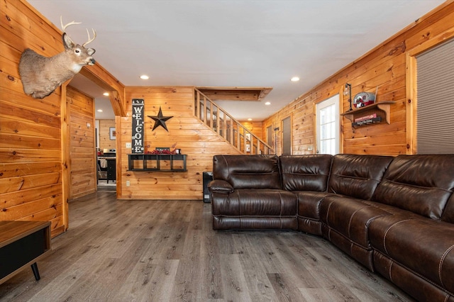 living room with wood-type flooring and wood walls