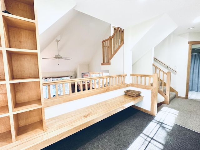 interior space with ceiling fan and carpet floors