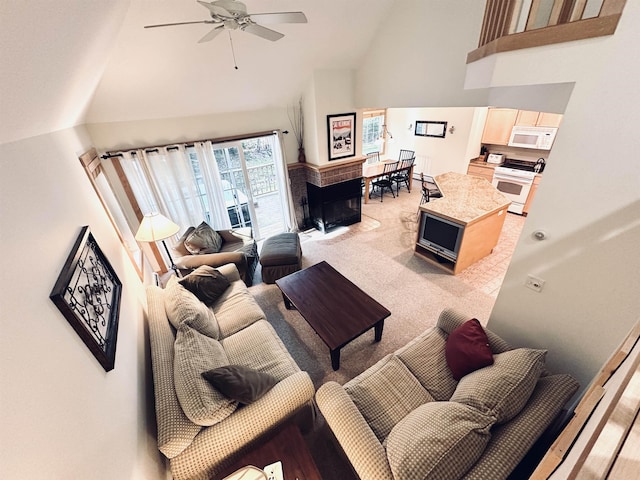 carpeted living room featuring high vaulted ceiling and ceiling fan