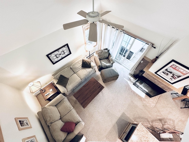 living room with ceiling fan and carpet