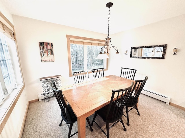 dining room with baseboard heating and carpet flooring