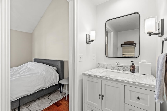 bathroom featuring hardwood / wood-style flooring and vanity