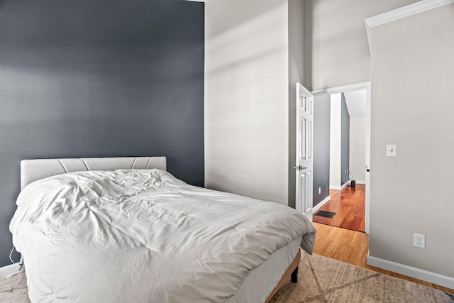 bedroom with light hardwood / wood-style floors