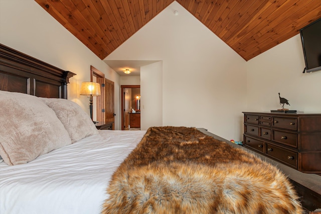 bedroom with wood ceiling, ensuite bath, and high vaulted ceiling