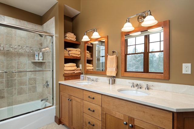 bathroom featuring enclosed tub / shower combo and vanity