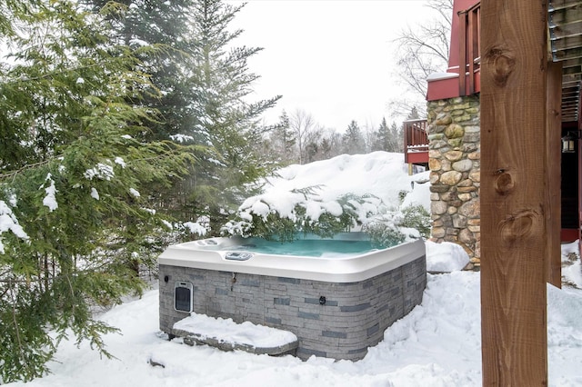 yard covered in snow with a hot tub