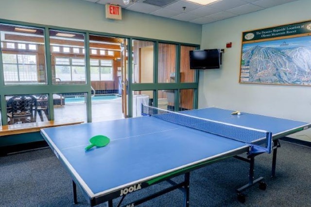 playroom with a paneled ceiling