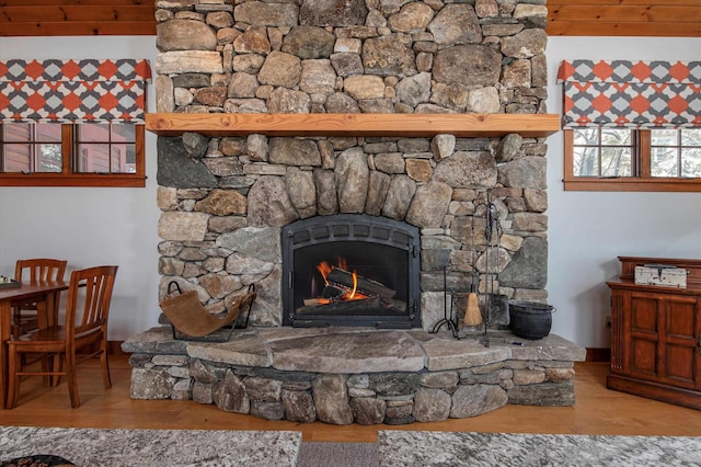 details with hardwood / wood-style floors and a fireplace