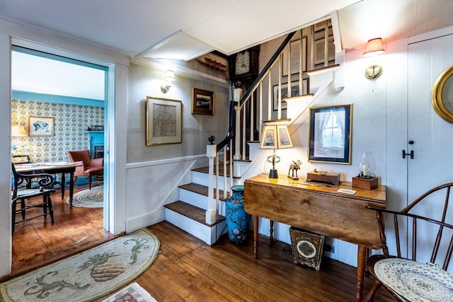 stairway featuring hardwood / wood-style floors